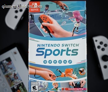A box of Nintendo Switch Sports is prominently featured, surrounded by various Nintendo Switch controllers and a screen displaying a related interface. The box art depicts animated characters playing sports, such as tennis, with vibrant colors and action-oriented poses.
